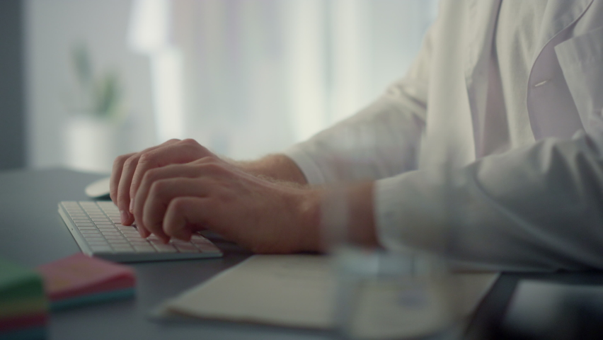 Physician hands typing keyboard in hospital office close up. Unknown doctor working on modern computer sitting cabinet health clinic. Technological medical workplace for consultation online.  Royalty-Free Stock Footage #1090422241