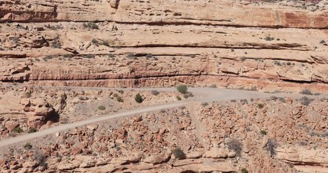 Moki Dugway steep mountain road desert Utah part 1. Roadway carved from a mountain cliff. Scenic cliff Backway of Highway 261 and very narrow. Trail of the Ancients.