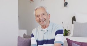 Animation of happy caucasian senior man looking at camera. retirement and senior lifestyle concept digitally generated video.