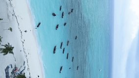 Vertical video of the ocean near the coast of Zanzibar, Tanzania, aerial view