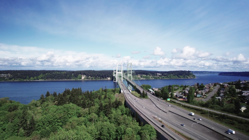 Daily commuters travel across the Tacoma Narrows Bridge, crossing Puget Sound, aerial