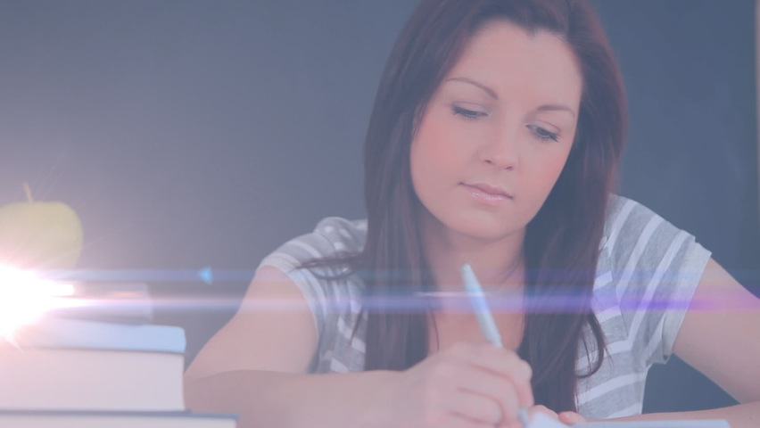 Animation of light over caucasian woman writing in notebook. hand writing, making notes and learning concept digitally generated video. | Shutterstock HD Video #1090431753