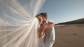 Animation of light over happy caucasian newly married couple kissing. love, romantic relationship and marriage concept digitally generated video.