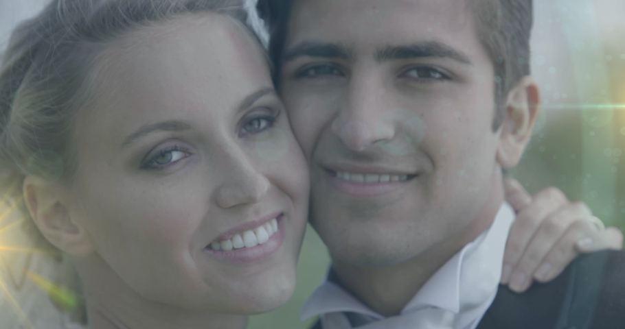 Animation of light over happy caucasian newly married couple kissing. love, romantic relationship and marriage concept digitally generated video. | Shutterstock HD Video #1090432429