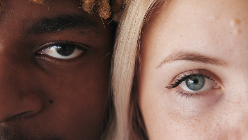 Diverse couple. Interracial relationship. International love. Closeup of confident happy man blonde woman eyes half face romantic portrait.