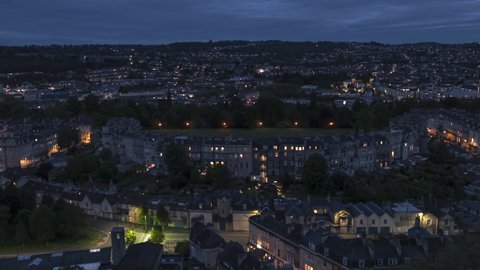 Establishing Aerial View Shot of Bath UK, Somerset, England United Kingdom night evening, royal crescent, push in
