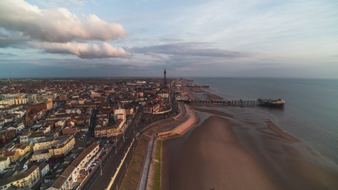 Establishing Aerial View Shot of Blackpool UK, Lancashire, England United Kingdom, wonderful afternoon, push in over the beach high