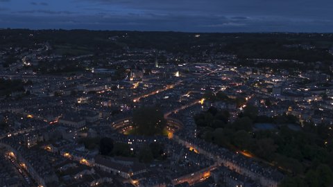 Establishing Aerial View Shot of Bath UK, Somerset, England United Kingdom night evening, city skyline, circus