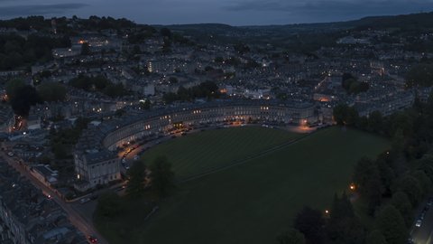 Establishing Aerial View Shot of Bath UK, Somerset, England United Kingdom night evening, royal crescent, rise up crane shot