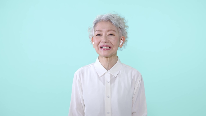 Smiling Asian senior woman. Facial expression. | Shutterstock HD Video #1090438815