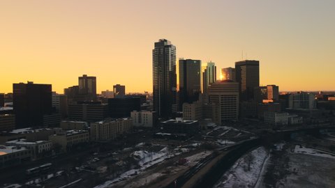 WINNIPEG, CANADA - May 15, 2022: A beautiful view of the Winnipeg skyline at sunset in winter