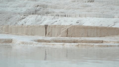 Pamukkale's terraces are made of travertine, a sedimentary rock deposited by mineral water from the hot springs