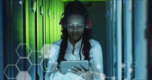 Animation of data processing over african american female worker in server room. global business, cloud computing and digital interface concept digitally generated video.