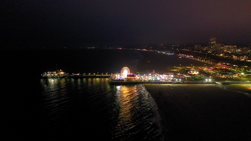 An aerial slow movement around Santa Monica pier in night | Shutterstock HD Video #1090441957