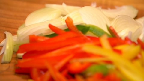 Peppers. Slicing peppers in slow motion. Culinary and cooking.