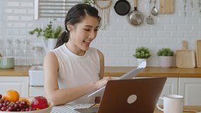 young Asian businesswoman using computer laptop talking for video call conference meeting. work from home concept.