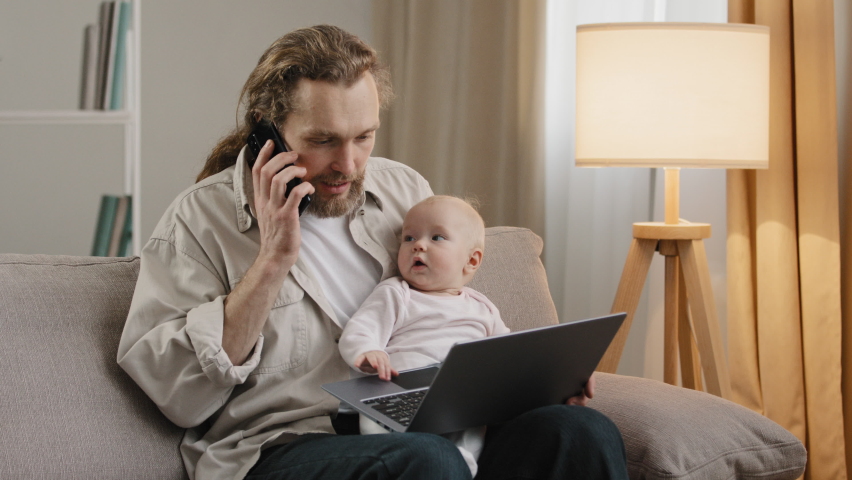 Busy father adult business man single dad multitasking at home holding little daughter newborn talking on phone negotiation typing laptop baby typing computer mistake break lost file problems loosing Royalty-Free Stock Footage #1090445143