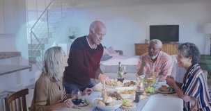 Animation of hearts over diverse group of seniors eating. senior home hangout and digital interface concept digitally generated video.