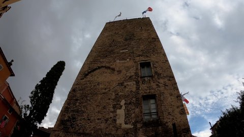 Grasse, France,  October 3, 2021: DOLLY SLOW MOTION SHOT - The former Bishop's Palace now serving as Grasse City Hall. A tufa tower constitutes the remains of the medieval bishop’s palace.