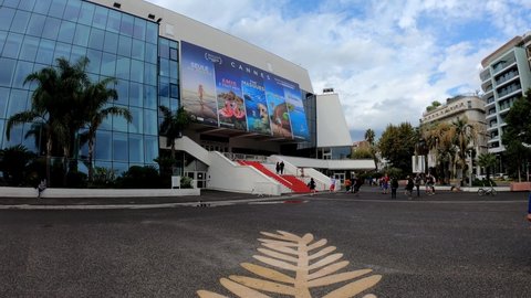 Cannes, France, October 3, 2021: TILT SLOW SHOT - Red Carpet stairs - Grand Auditorium Louis Lumiere and the Golden Palm on the floor. Cannes is the host city of the annual Cannes Film Festival.
