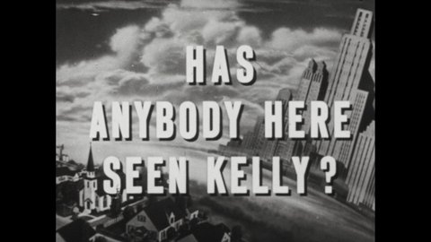 1940s: Title card reads "Has Anyone Here Seen Kelly?"; signs and banners welcome home Kelly from war; propeller plane taxis on runway; Woman in floral hat peers through gate.