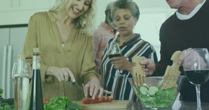 Animation of salad icons over diverse group of seniors cooking. senior home hangout and digital interface concept digitally generated video.