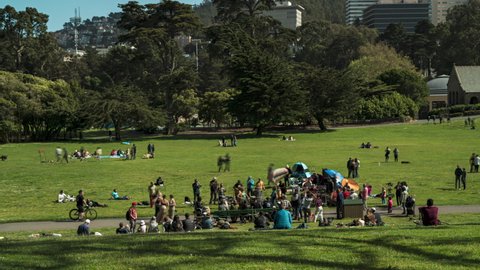 San Francisco, CA, United States - May 8 2022: Drum Circle at Hippy Hill in Golden Gate Park, Timelapse of people