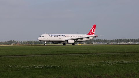 Schiphol, Amsterdam Netherlands - May 19 2022: Slow motion 4x of an Airbus A 321 taking off with tourists of the company of Turkish Airlines at Schiphol Airport in Amsterdam.
