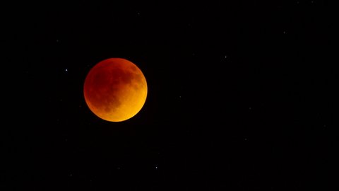 Total lunar eclipse of a full moon causes a very rare Super Blood Moon in the night sky.