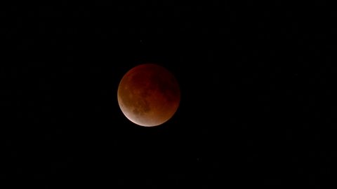 Total lunar eclipse of a full moon causes a very rare Super Blood Moon in the night sky.