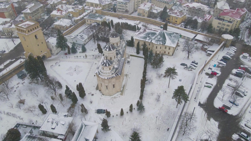 Aerial view above the assembly of Golia Monastery from Iasi city, Romania. Footage shot from a drone in winter season. Birds eye view over Golia Monastery, Iasi, Romania.