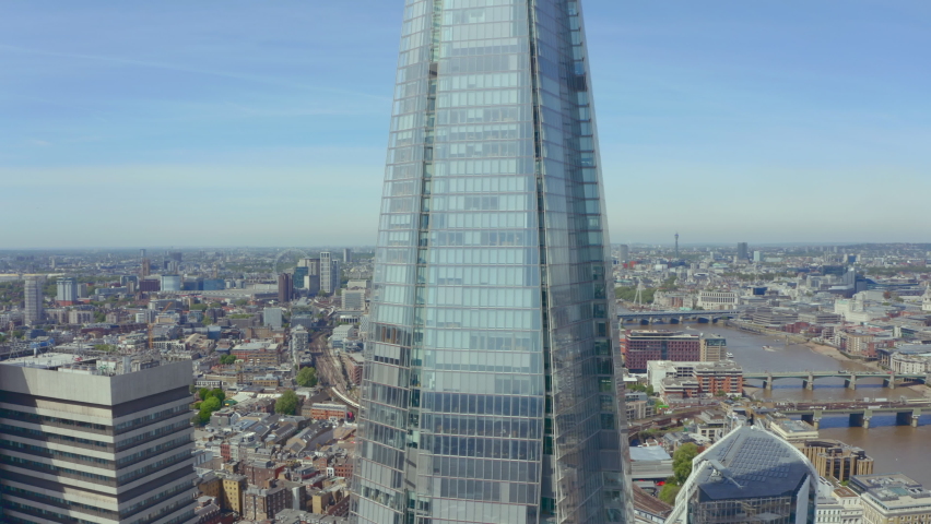 Circling revealing drone shot of the shard Central London