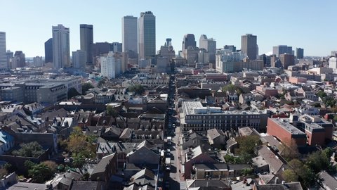 Reverse pullback aerial shot of Bourbon Street during the day in the French Quarter of New Orleans. 4K