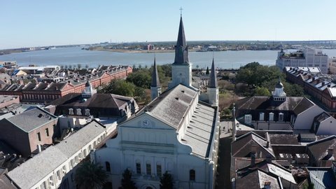 Aerial panning shot around the St. Louis Cathedral in the French Quarter of New Orleans. 4K