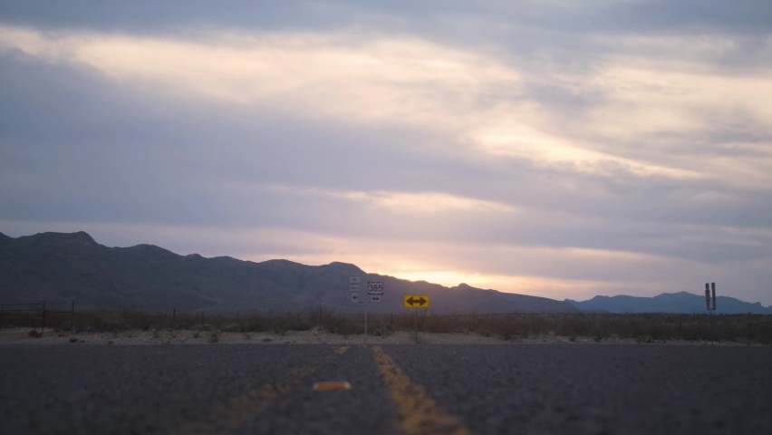 Chisos Mountain Sunset in West Texas with Low Angle Slide across Highway 4K