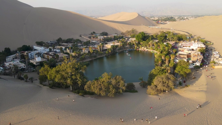 Ica, Peru - April 18 2021: An aerial view of Huacachina oasis located in the peruvian desert Royalty-Free Stock Footage #1090458813