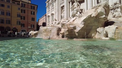 tourists near the. Trevi Fountain is the largest fountain in Rome Italy on a sunny day.  Italy Rome travel destination. Rome Italy March 30  2022