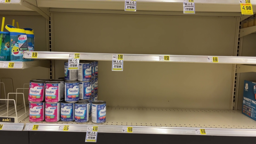 ATLANTA, GEORGIA - May 20, 2022 : Infant baby formula product shortage. Empty Similac baby food shelves at an American grocery store supermarket.