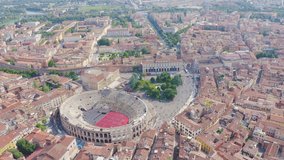 Inscription on video. Verona, Italy. Flying over the historic city center. Arena di Verona, summer. Heat burns text, Aerial View