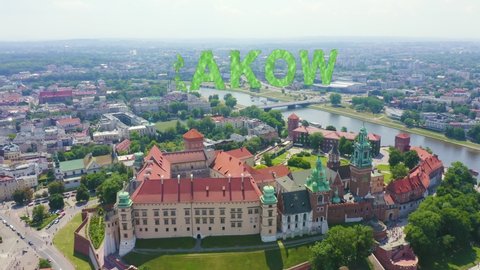 Inscription on video. Krakow, Poland. Wawel Castle. Ships on the Vistula River. View of the historic center. Text furry, Aerial View