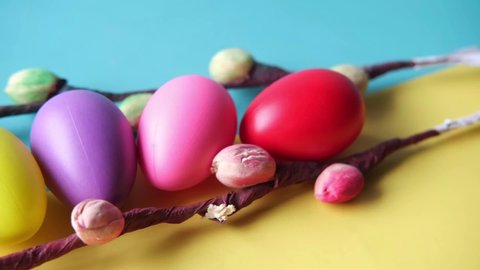 easter concept with multi color egg on pink background.