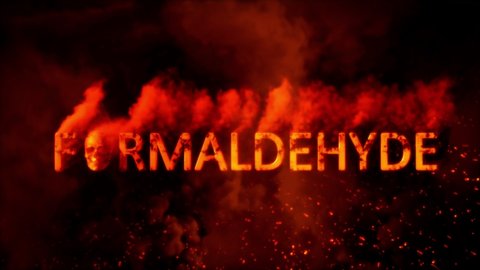 Text formaldehyde with scary man skull on burning backdrop - loop video