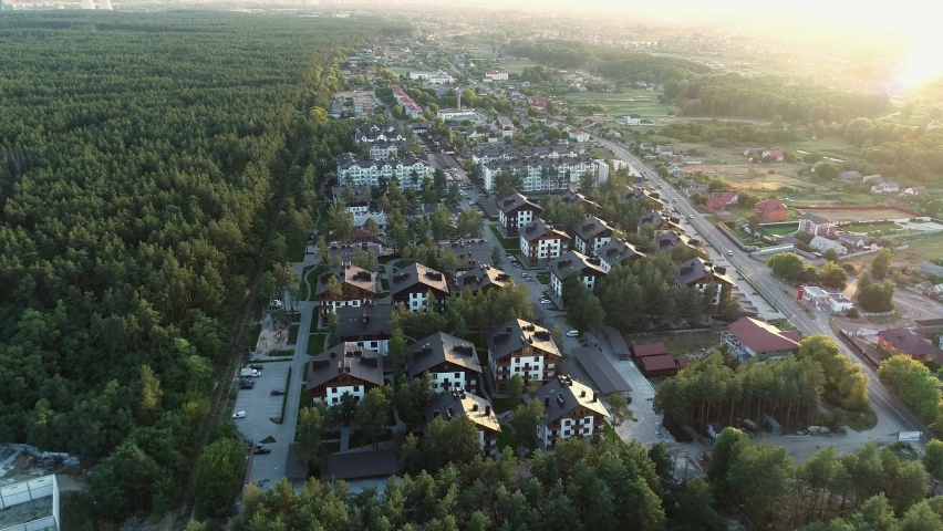 Aerial view of a residential area in the forest. 4k video drone footage | Shutterstock HD Video #1090469727