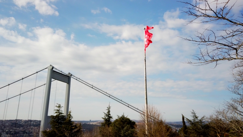 Istanbul view. Cityscape of Istanbul with Turkish flag and Fatih Sultan Mehmet Bridge from otagtepe