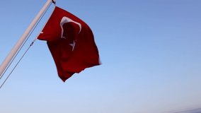 Turkish flag. Waving Flag of Turkey on blue sky background with copy space. 19 may or 23 april or 30 august or 29 october background 4K video. 