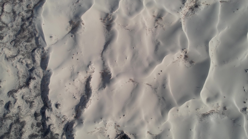Desert Landscape, Top Down Abstract Aerial View of Sand Patterns. Ascending Drone Shot