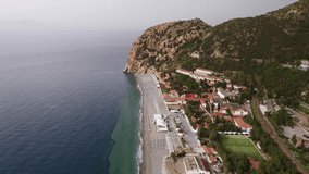 Aerial drone footage. Video of Capo Calava bay and beach, with several holiday parks and villages, near Gioiosa Marea, Sicily, Italy.
