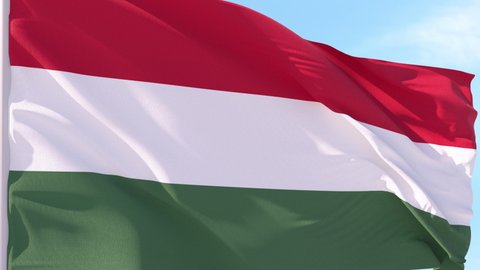 Hungary Flag Looping Background fluttering in the wind against a blue sky on a seamless loop.