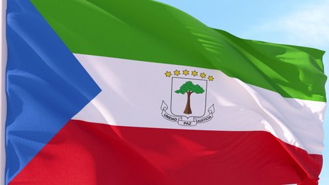 Equatorial Guinea Flag Looping Background fluttering in the wind against a blue sky on a seamless loop.