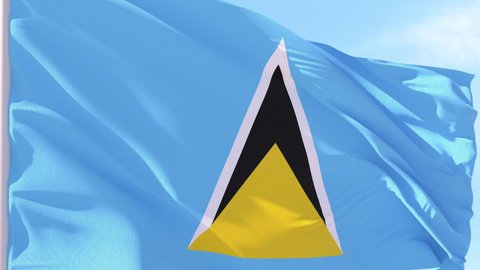 Saint Lucia Flag Looping Background fluttering in the wind against a blue sky on a seamless loop.